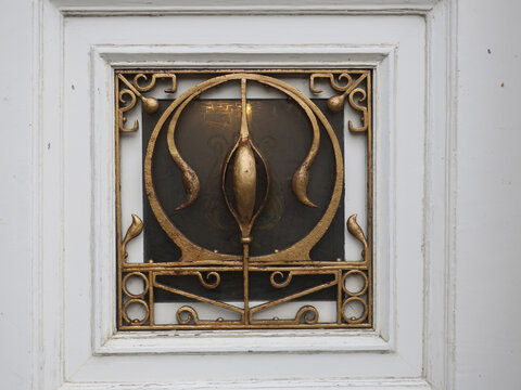 golden iron  ornament protecting a square window