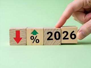 Hand stacking wooden blocks with down arrow and percentage symbol for 2026 financial decline concept