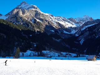 Cross-country skier at the foot of the Spitzhorn, Gsteig