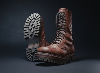 3d rendering of retro brown leather boots on a dark background. High vintage lace-up design with realistic scuffs and a worn-out look. Detailed heavy sole with tread patterns. Footwear concept.