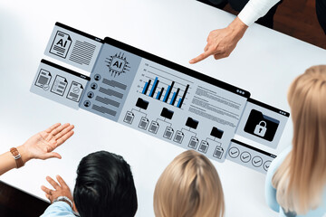 A diverse group of business professionals engages in a discussion around a digital display showcasing data insights and visualizations, emphasizing teamwork and modern technology. Gantry