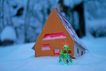 a model house standing in the snow