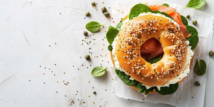 Delicious Bagel Sandwich Burger: toasted bagel filled with creamy cheese, smoked salmon, fresh spinach