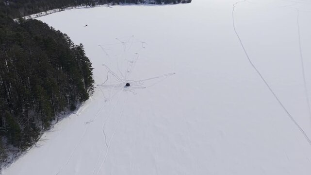 Aerial View of Northern Ice Shack on Frozen Snow Covered Lake - Island Pond, Vermont