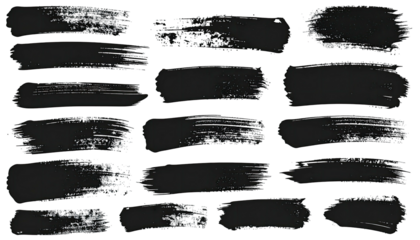 Collection of various brushstrokes in dark grey with rough edges, layered on a black background
