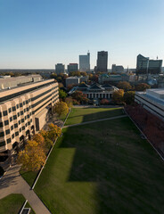 Aerial view of the North Carolina State Legislature building, state government complex, and downtown Raleigh skyline with Fall colors