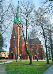 Cathedral of Sts. Peter and Paul between bare trees  in winter Gliwice, Poland