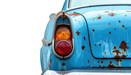 Detail of an aged classic car's rear, showing rust and worn paint against black background