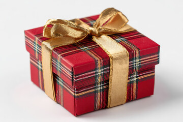 Fototapeta premium Festive Red Plaid Gift Box with Gold Ribbon on White Background Perfect for Holiday Celebrations and Seasonal Promotions