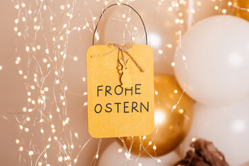 Wooden Easter sign with Frohe Ostern text and lights
