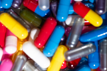 Close up of Colorful Pill Capsules in Various Bright Colors