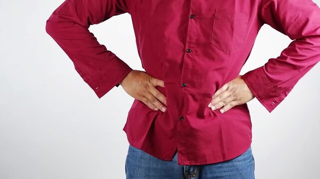 Concepts of bloating, feeling full, digestive problems or abdominal discomfort, stomach ache, a man's hand holding and massaging his stomach, liver disease, gastritis, or cramps. BeH3althy