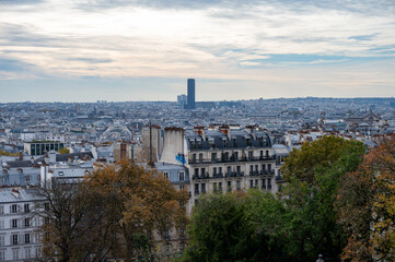 Obraz premium Walking on Montmartre hilly historical artistic district of Paris with famous buildings and narrow streets, tourists destination in France