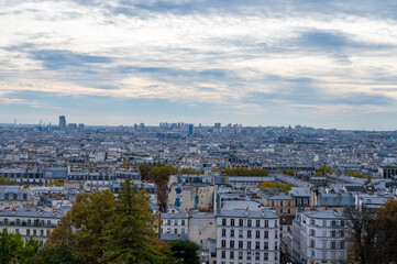 Fototapeta premium Walking on Montmartre hilly historical artistic district of Paris with famous buildings and narrow streets, tourists destination in France