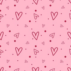 Seamless raster pattern with hand-drawn hearts in doodle style on a pink background