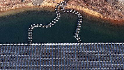 Abstract Aerial View of Floating Solar Panel Infrastructure on Water