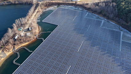 Aerial View of Floating Solar Panel Array on Freshwater Reservoir in New Jersey