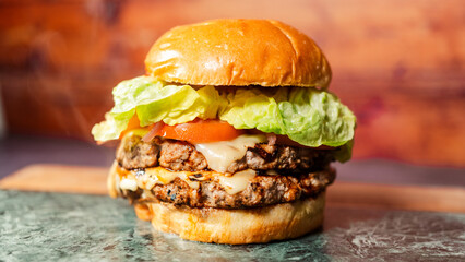 Classic cheeseburger with fresh lettuce, ripe tomato, melted cheese, and special sauce. Juicy, flavorful, and simply delicious. Perfect for traditional fast food lovers and everyday meals.