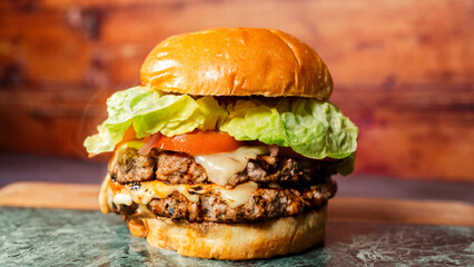 Classic cheeseburger with fresh lettuce, ripe tomato, melted cheese, and special sauce. Juicy, flavorful, and simply delicious. Perfect for traditional fast food lovers and everyday meals.