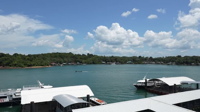 B roll of Oceanna Baruna Jaya ferry sailing between Tanjung Balai Karimun and Batam showing passenger transport across calm sea with coastal views and daily island connectivity