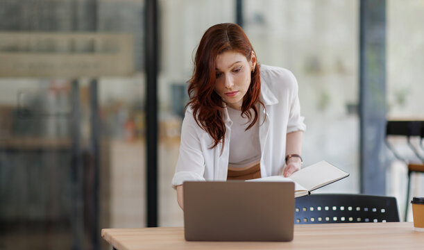 Business woman, administrator and review with folder for company tax, finance or report in office. Female person, employee or admin with documents or file for backlog, expenses or financial records

