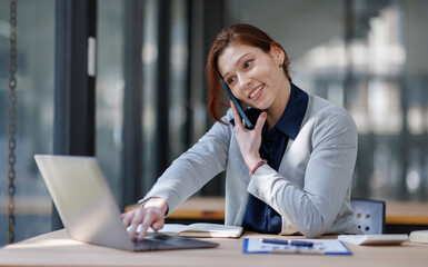 Fototapeta premium Woman, phone call or happy at laptop for business, budget review or positive feedback. Accountant, computer or tech in office for communication, account management or smile for investment opportunity 