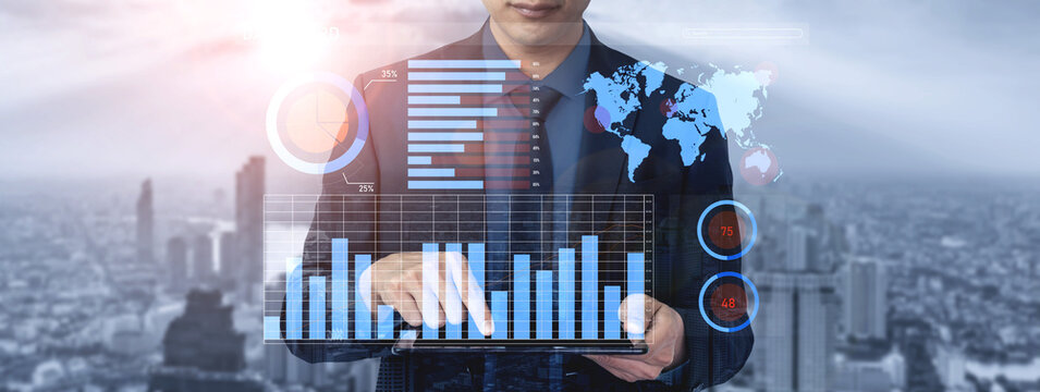 A businessman engages in financial data analysis using digital graphs and charts, set against a dynamic cityscape, showcasing modern business strategies. Impute - Powered by Adobe