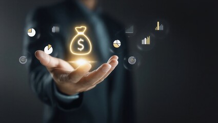 Businessman Hand Holding Glowing Gold Money Bag Icon with Financial Data Overlay