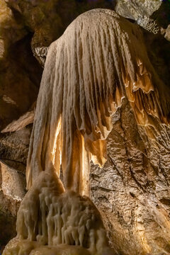 Punkva Cave interior in the Moravian Karst with limestone chambers, stalactites, stalagmites, and an underground river. Karst geology environment showing rock formations, subterranean landscape