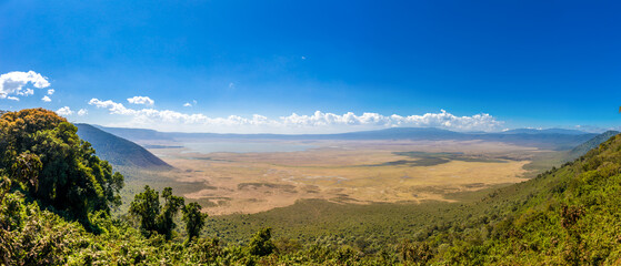 Ngorongoro natural landscape with volcanic caldera, open grasslands, crater walls, and lakes in Tanzania. African environment showing unique geology, wildlife habitat, conservation area, safari region © Yuliia