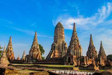 Fototapeta premium Ayutthaya historical park in Thailand with ancient temple ruins, brick stupas, and archaeological structures. UNESCO World Heritage site showing cultural heritage, Buddhist architecture, historic city