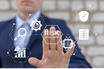 Business person using virtual touch screen presses the text RISK ASSESSMENT. Risk Assessment Attention Business Financial concept. Risky evaluation. Crisis management.