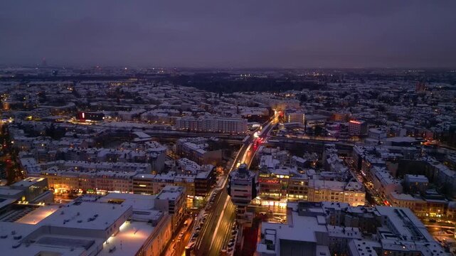 Berlin City rooftops covering in snow at dusk. Gorgeous aerial view drone