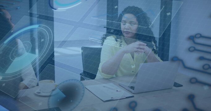 Leading woman in light yellow blouse guiding team at meeting table with laptop, clipboard, HUD - Powered by Adobe