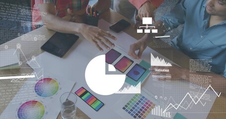 Collaborating three adults in casual attire reviewing UI mockups in office, using color swatches