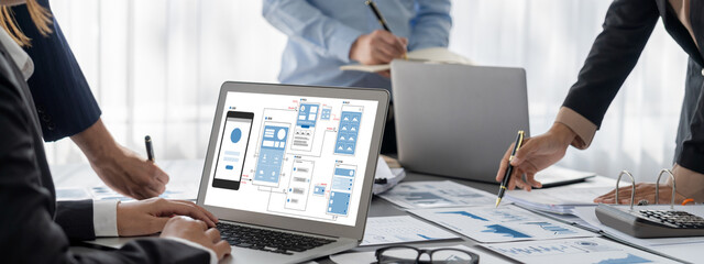 Business intelligence and data analysis concept. Analyst team working on financial data analysis dashboard on laptop screen as marketing indication for effective business strategic planning. Insight