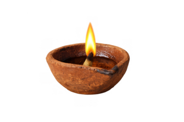 Traditional clay diya oil lamp burning with a bright flame, symbolizing light, spirituality, and diwali celebration on transparent background