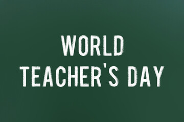 Obraz premium World Teacher's Day inscription on green chalkboard. Greeting card design