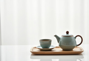 Obraz premium Minimalistic tea set on white background, zen aesthetic.