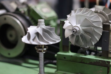 Turbocharger turbine shaft and compressor wheel assembly on a professional balancing machine,...