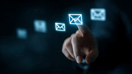 Professional hand selects glowing email icon on digital interface, symbolizing communication and connection in a modern digital world