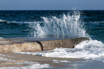 Sea waves breaking into foam