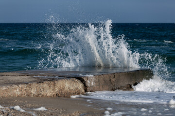 Sea waves breaking into foam