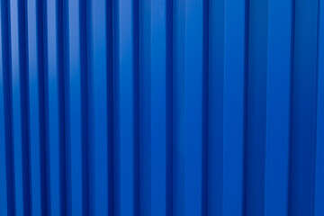 Obraz premium Blue Corrugated Metal Sheet Texture Background,High angle view of blue corrugated metal wall or roofing sheet with diagonal lines. Abstract geometric background of industrial material with repeating 