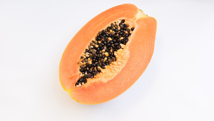 Half of fresh ripe papaya isolated on white bacgkround. Close up