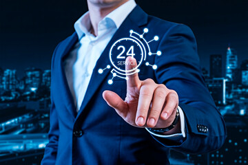 Man in suit touching 24 hours service icon for the concept of technology.