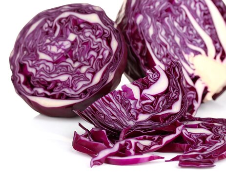 A close-up shot of several fresh, halved red cabbages against a white background, revealing intricate layered texture - Powered by Adobe