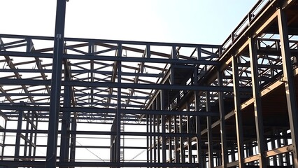 girder. Steel frame structure during construction phase with natural daylight and dramatic shadows. real-estate listings.