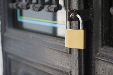 Lock on a door shows security and closure in a city