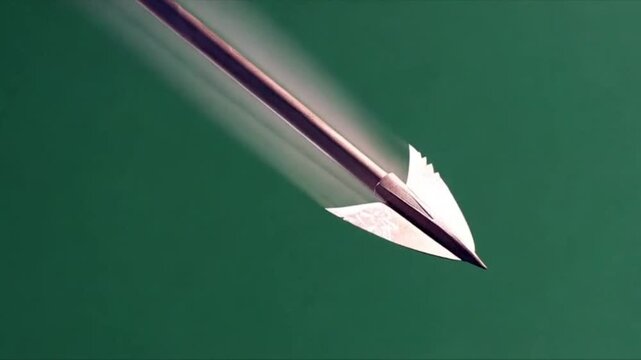 Motion blur shot of an arrow flying swiftly through the air against a green background, symbolizing speed, focus, and hitting a business target.